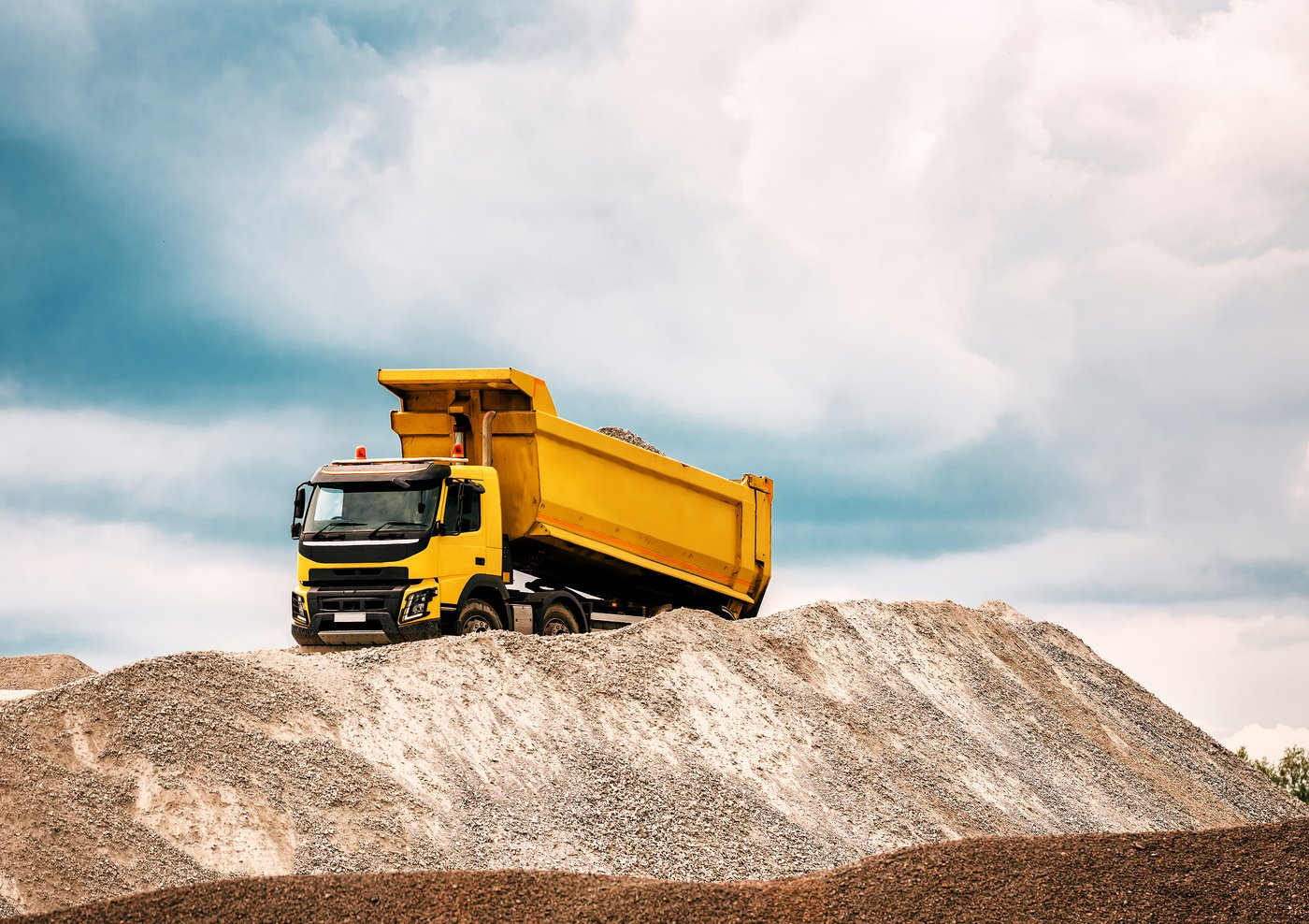 dump truck drops gravel